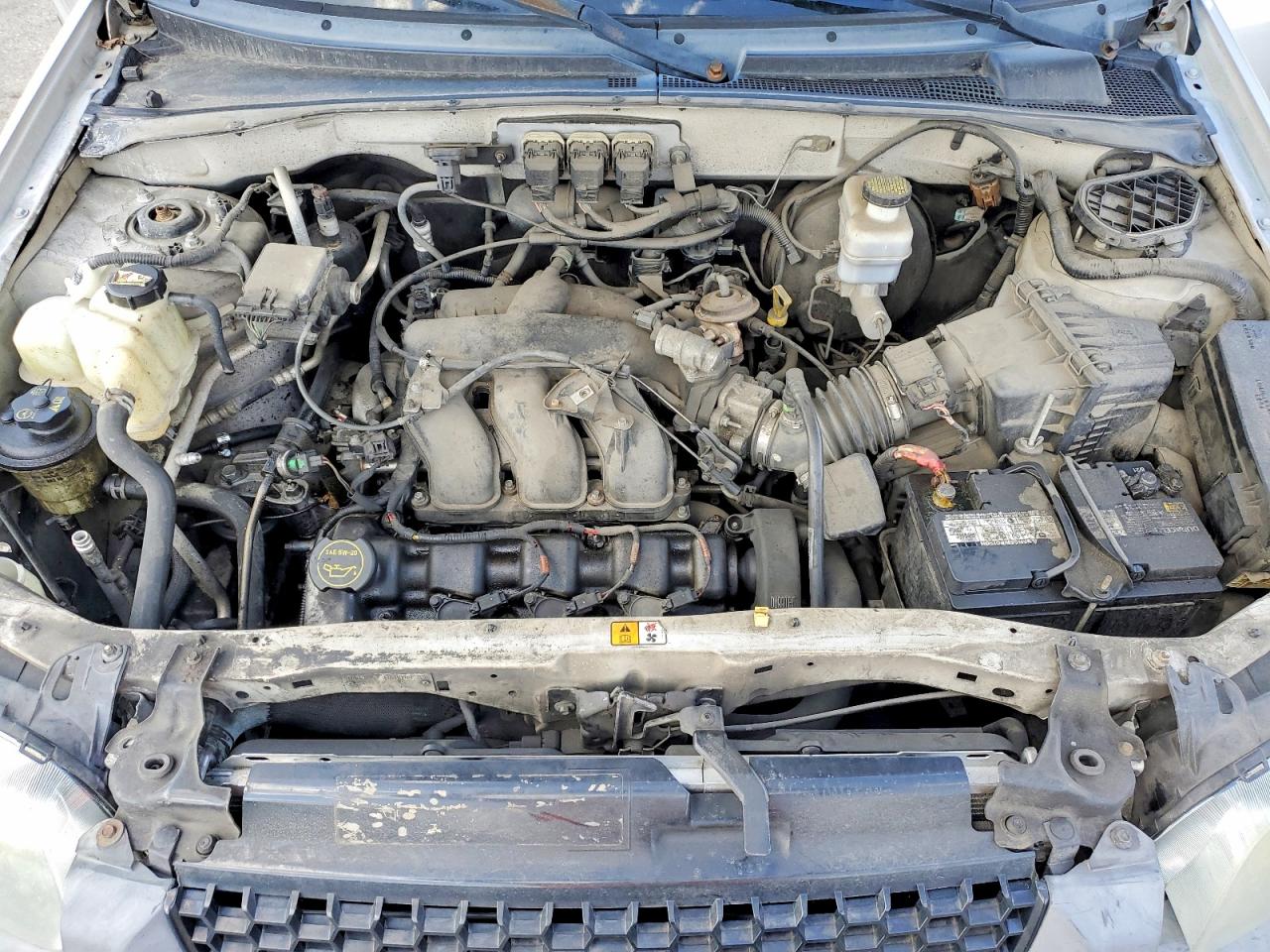 FORD ESCAPE 2005 — 13